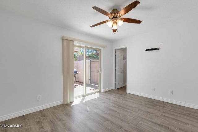13636 N Hamilton Dr Unit 101, Fountain Hills, AZ 85268 - empty room with baseboards, ceiling fan, and wood finished floors