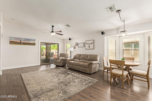 living area featuring baseboards, a ceiling fan, and visible vents