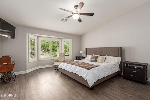 bedroom with dark wood-style floors, baseboards, visible vents, lofted ceiling, and a ceiling fan