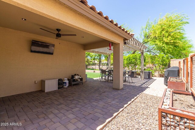 view of patio / terrace featuring a ceiling fan, area for grilling, outdoor dining area, and a fenced backyard