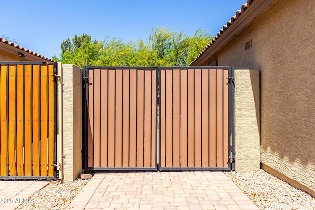 view of gate with fence