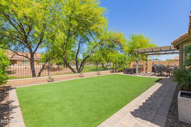 view of yard with a fenced backyard, a pergola, and a patio area