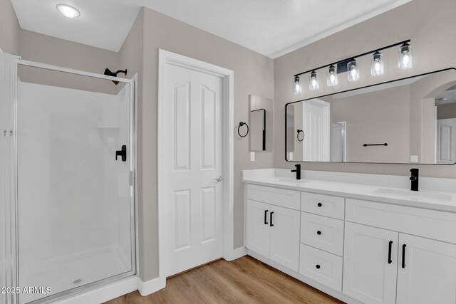 3376 E Lafayette Ave, Gilbert, AZ 85298 - bathroom with double vanity, a stall shower, and wood finished floors