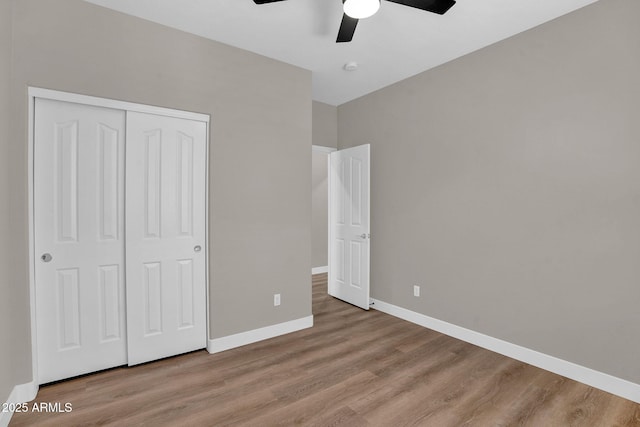 3376 E Lafayette Ave, Gilbert, AZ 85298 - unfurnished bedroom featuring wood finished floors, a closet, and ceiling fan