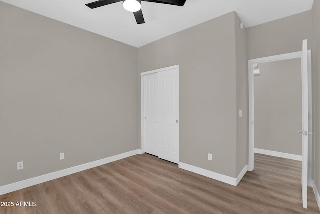 3376 E Lafayette Ave, Gilbert, AZ 85298 - unfurnished bedroom featuring wood finished floors, a closet, and a ceiling fan