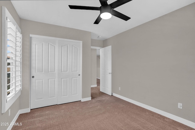 3376 E Lafayette Ave, Gilbert, AZ 85298 - unfurnished bedroom featuring carpet, a closet, multiple windows, and ceiling fan