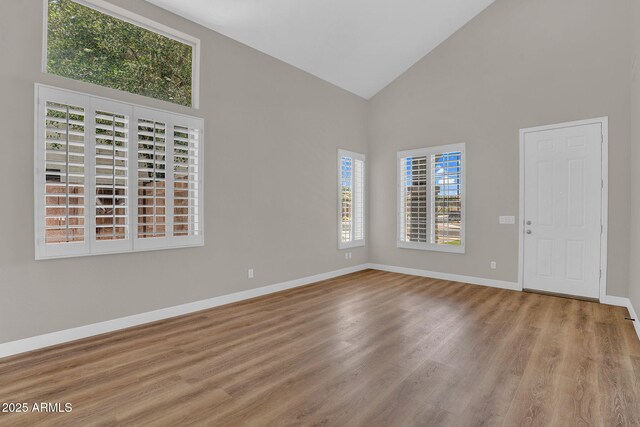 3376 E Lafayette Ave, Gilbert, AZ 85298 - spare room featuring high vaulted ceiling and wood finished floors