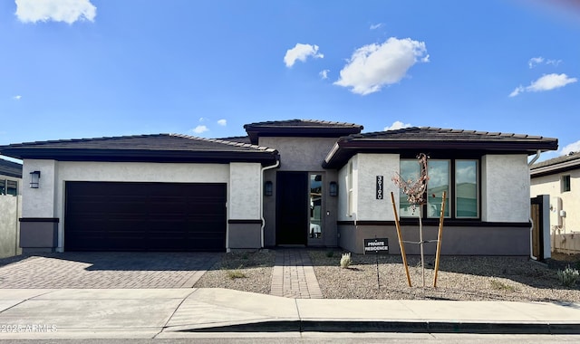 prairie-style home featuring a garage