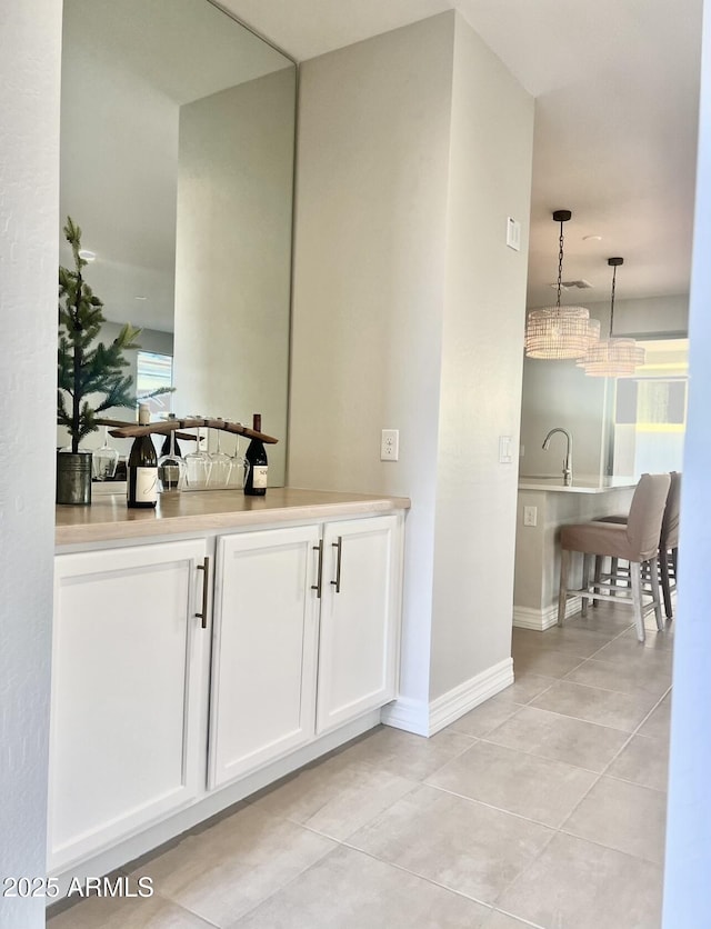 bathroom with tile patterned floors and sink