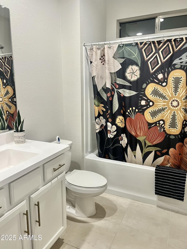 full bathroom featuring vanity, shower / tub combo, tile patterned floors, and toilet