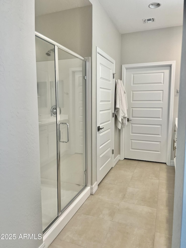 bathroom featuring an enclosed shower