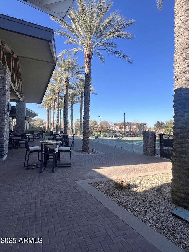 view of patio featuring a water view