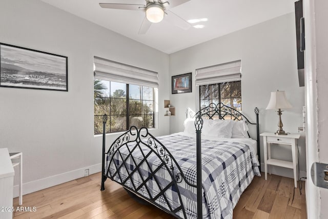 bedroom with wood-type flooring and ceiling fan