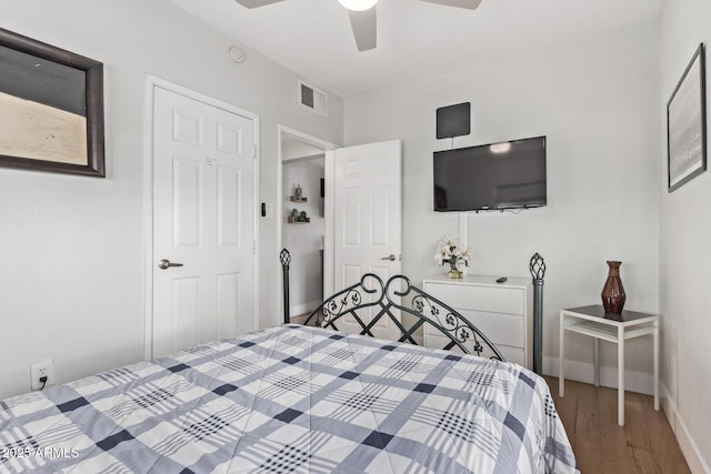 bedroom featuring ceiling fan and dark hardwood / wood-style floors