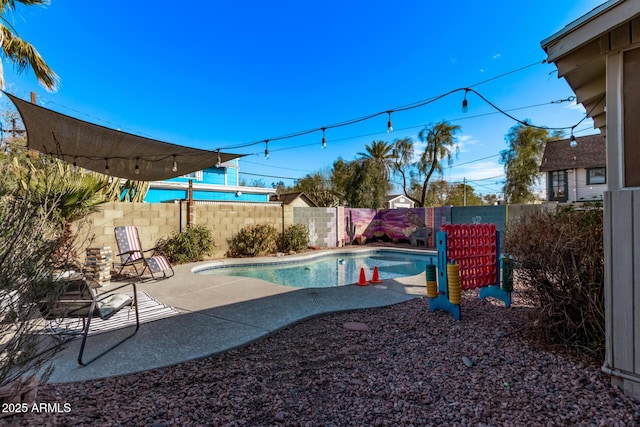 view of swimming pool with a patio area