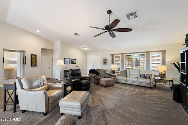 living room with ceiling fan, lofted ceiling, and dark carpet