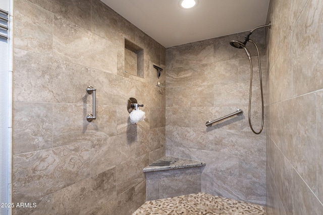 bathroom featuring a tile shower