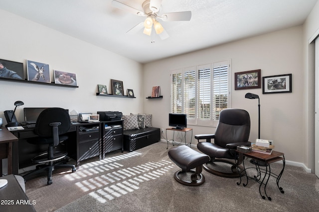 office with carpet floors and ceiling fan