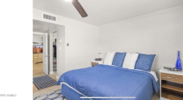 bedroom with a ceiling fan and visible vents
