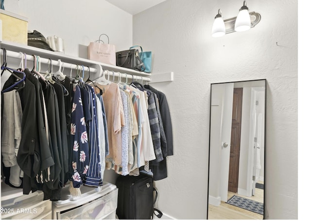 spacious closet with wood finished floors