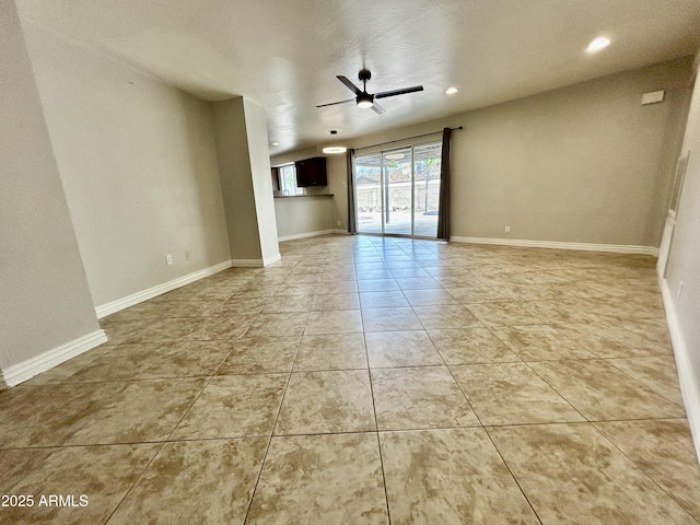 empty room featuring a ceiling fan, baseboards, recessed lighting, and light tile patterned floors