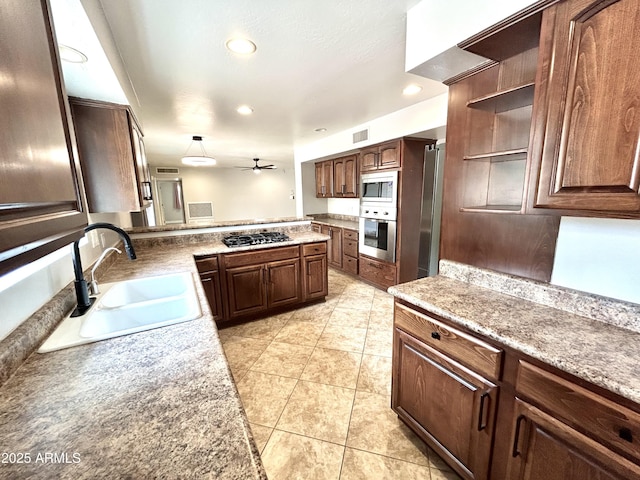 kitchen with a ceiling fan, open shelves, a sink, appliances with stainless steel finishes, and visible vents