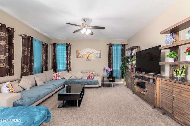 living room featuring light carpet and ceiling fan