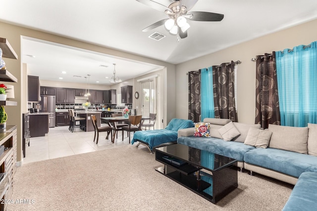 living area with a ceiling fan, light tile patterned floors, light colored carpet, visible vents, and recessed lighting