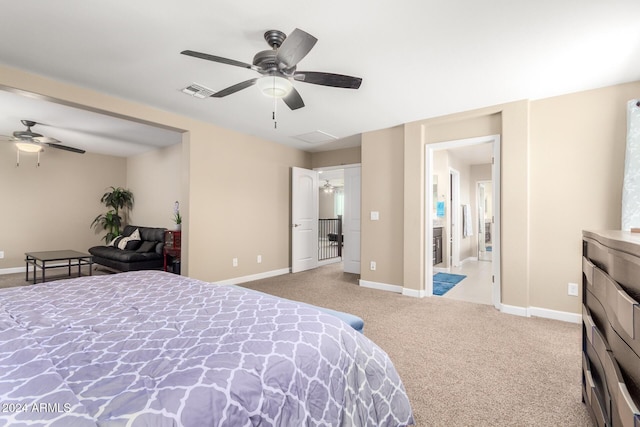 carpeted bedroom featuring baseboards, visible vents, and ceiling fan
