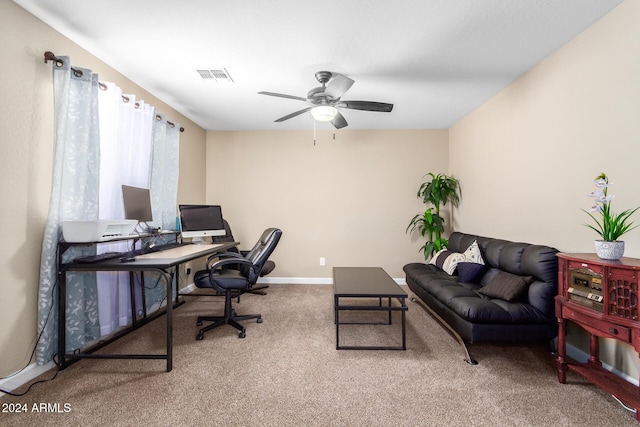 office with baseboards, carpet floors, visible vents, and a ceiling fan
