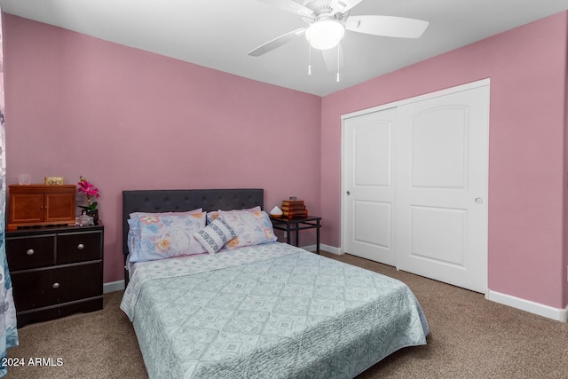 carpeted bedroom with baseboards, a closet, and ceiling fan