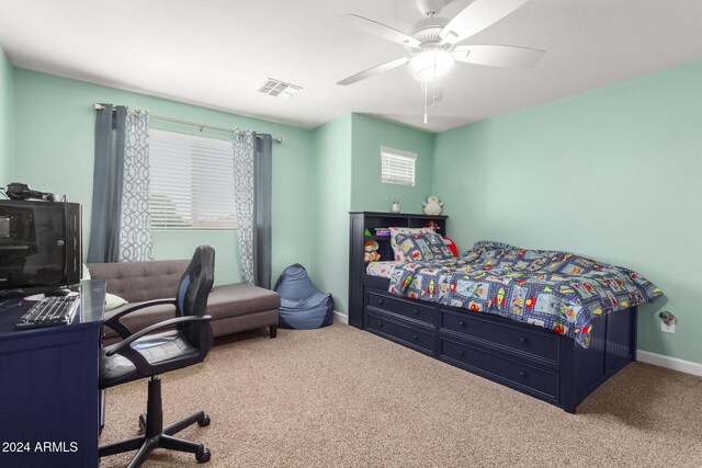 carpeted bedroom with baseboards, ceiling fan, and visible vents