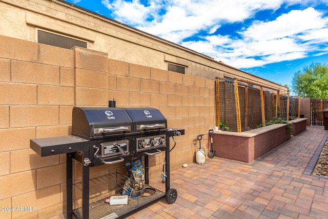 view of patio / terrace with fence and area for grilling