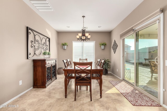 dining area with a notable chandelier and a wealth of natural light