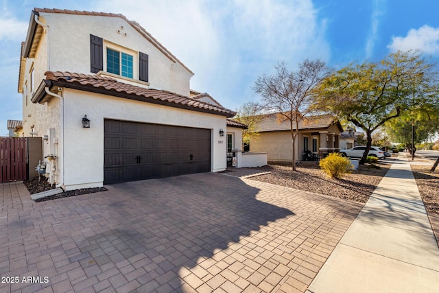 mediterranean / spanish house with a garage