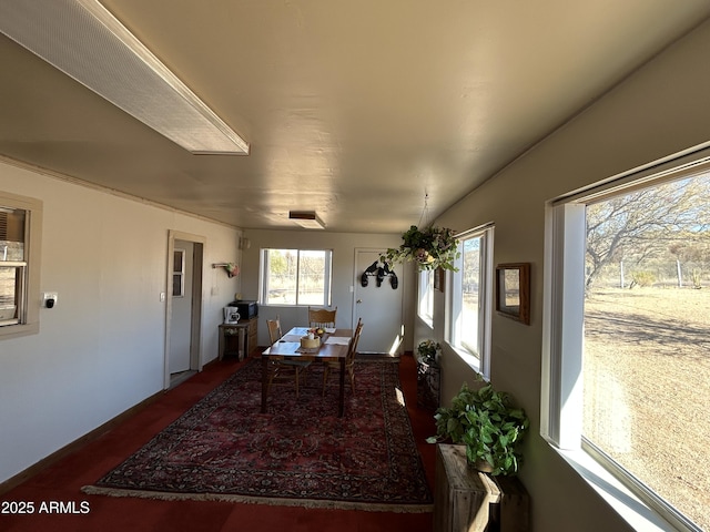 dining space with dark wood-type flooring