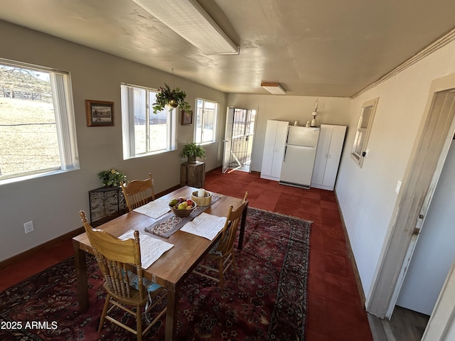 dining area featuring baseboards