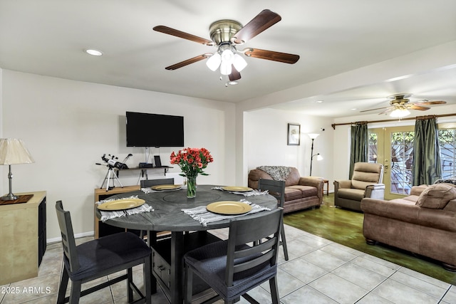 dining room featuring light tile patterned floors, french doors, and ceiling fan