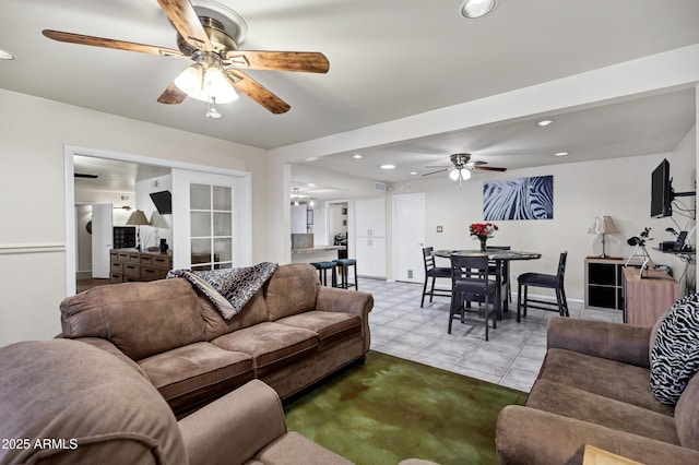 tiled living room featuring ceiling fan