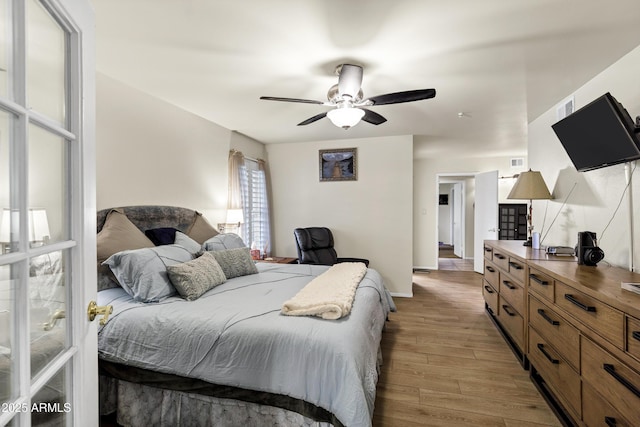 bedroom featuring ceiling fan and light hardwood / wood-style floors