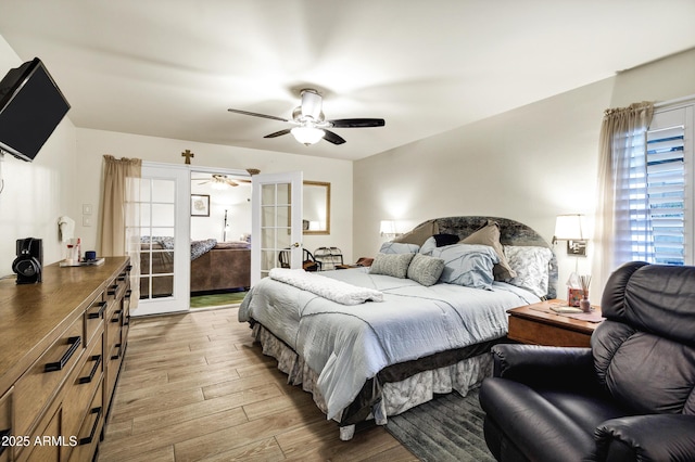 bedroom featuring light hardwood / wood-style flooring, french doors, and ceiling fan