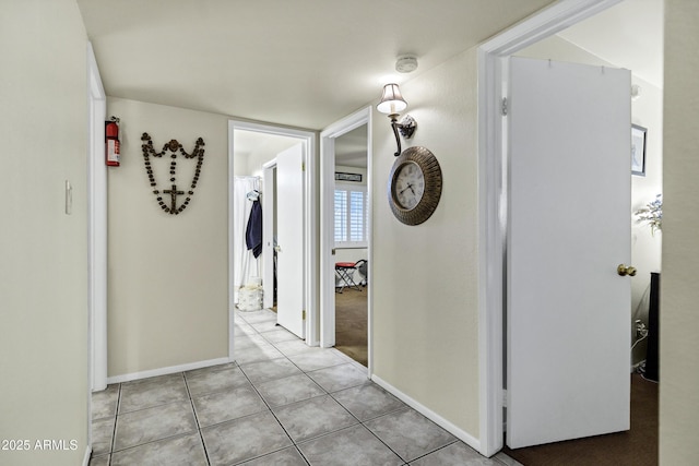 corridor featuring light tile patterned floors