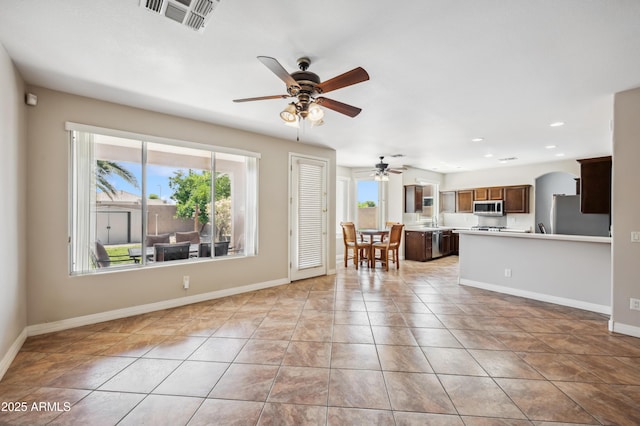 3905 S Bridal Vail Dr, Gilbert, AZ 85297 - living room with plenty of natural light, a ceiling fan, light tile patterned floors, baseboards, and recessed lighting