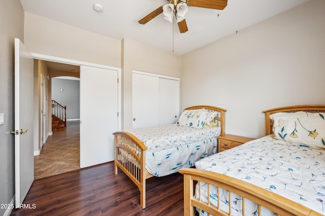 3905 S Bridal Vail Dr, Gilbert, AZ 85297 - bedroom with wood finished floors, a closet, arched walkways, and ceiling fan