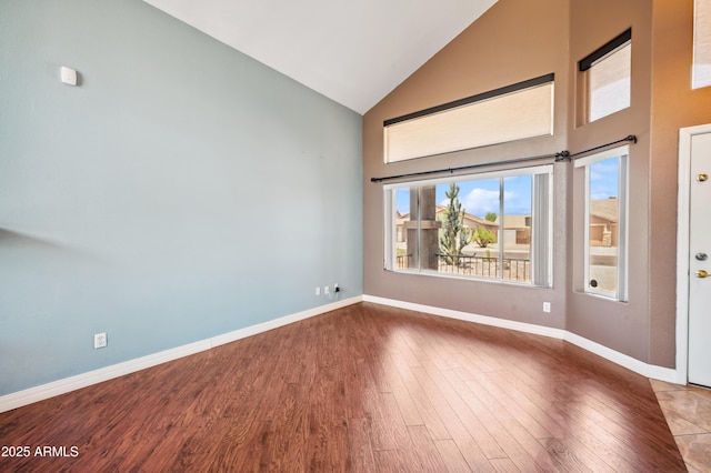 3905 S Bridal Vail Dr, Gilbert, AZ 85297 - spare room with high vaulted ceiling, baseboards, and wood finished floors