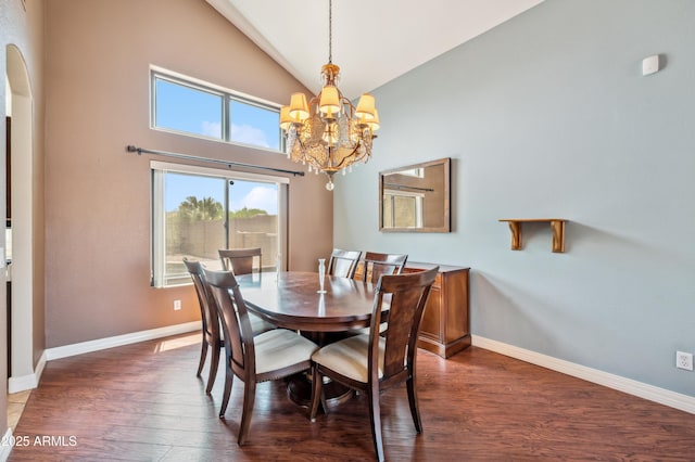 3905 S Bridal Vail Dr, Gilbert, AZ 85297 - dining area featuring a chandelier, dark wood finished floors, baseboards, and high vaulted ceiling