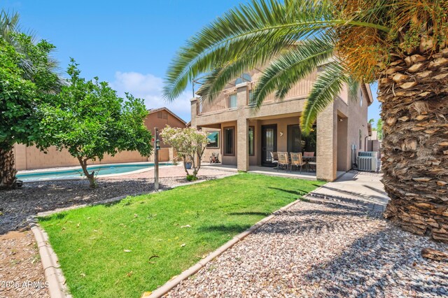 3905 S Bridal Vail Dr, Gilbert, AZ 85297 - rear view of house featuring central AC unit, a patio area, and stucco siding