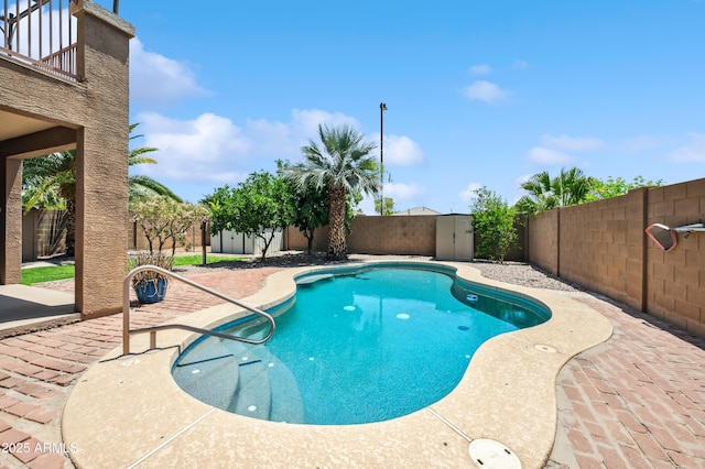 3905 S Bridal Vail Dr, Gilbert, AZ 85297 - view of pool featuring a fenced backyard, a patio, and a storage shed