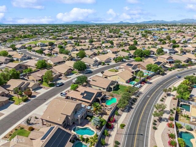 3905 S Bridal Vail Dr, Gilbert, AZ 85297 - aerial perspective of suburban area with a pool area and mountains