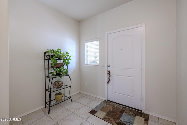 entrance foyer featuring light tile patterned floors